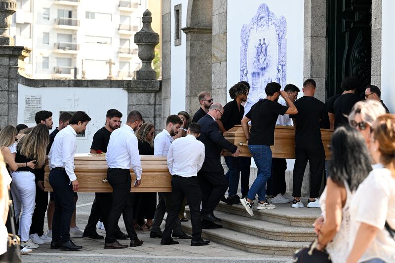 The Coffins of Diogo Jota And Andre Silva are carried by family, former teammates and friends into the Church. Photograph: Octavio Passos/Getty Images