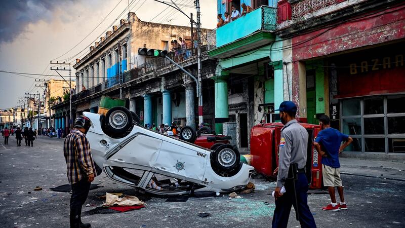 An overturnd police car in the wake of an anti-government protest in Havana, Cuba, on July 11th.  Photograph: Yamil Lage/AFP via Getty Images