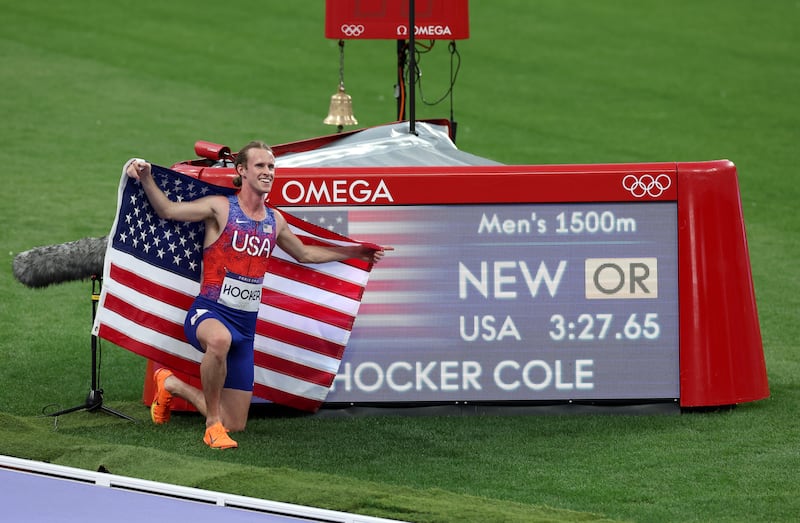 Cole Hocker celebrates winning the gold medal with a new Olympic record in the 1,500m. Photograph: Steph Chambers/Getty Images