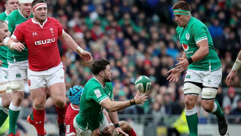 Robbie Henshaw offloads to CJ Stander during the game against Wales. Photograph: Bryan Keane/Inpho