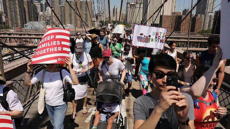 Thousands of people march in support of families separated at the US-Mexico border, in New York. Photograph: Spencer Platt/Getty Images