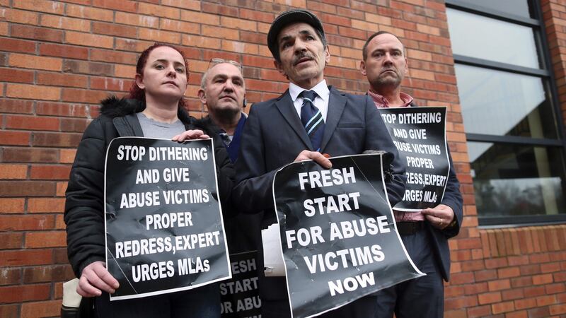 Alleged victim of historical institutional abuse Edward McCann (second right) poses with other alleged abuse victims Michael McMoran (second left) and John Carlton ( right) and McMoran’s daughter Katrina McMoran (left) outside the Crowne Plaza hotel in Belfast. Photograph: AFP