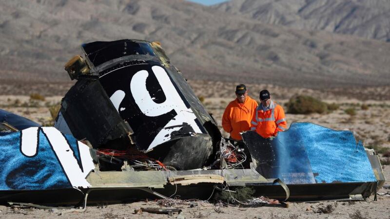Sheriffs’ deputies look at wreckage from the crash of Virgin Galactic’s SpaceShipTwo near Cantil, California yesterday. Photograph: David McNew/Reuters.