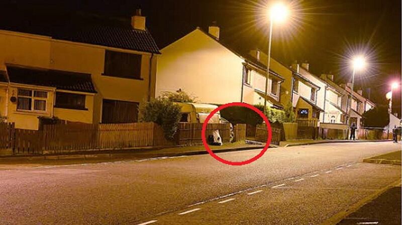 A handout photo made available by the Police Service of Northern Ireland (PSNI) showing the scene where a Command Wire Initiated Improvised Explosive Device was discovered during a large scale search operation in the Creggan area.