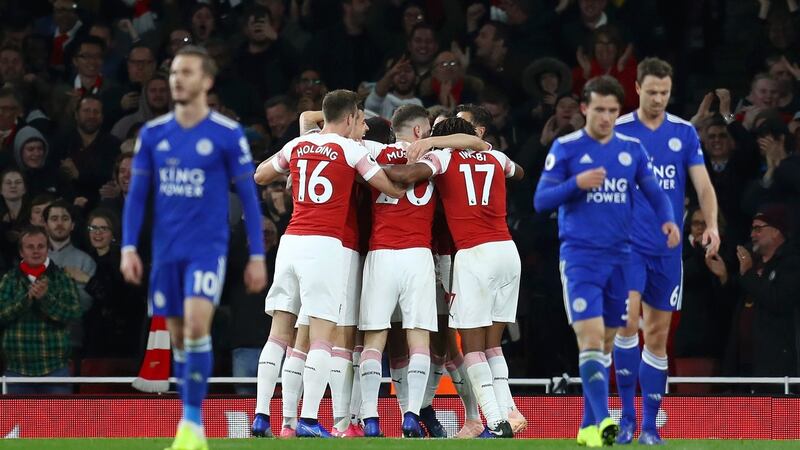 Aubameyang celebrates with teammates. Photo: Clive Rose/Getty Images