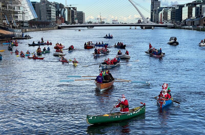  The 7th annual All in a Row charity fundraiser to commemorate thise who have drowned and to raise funds for the RNLI and the Irish Underwater Search and Recovery Unit gather at the Sean O’Casey bridge in Dublin to lay wreaths. Photograph: Alan Betson

