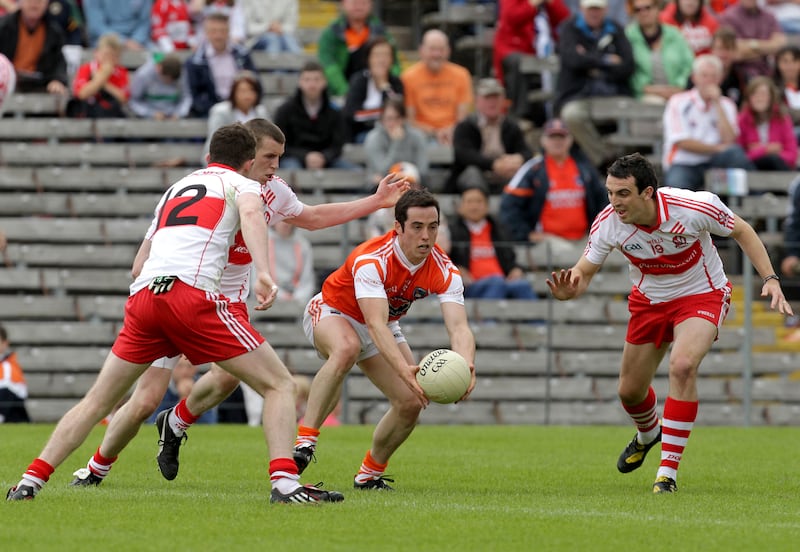 Armagh's Aaron Kernan surrounded by Derry players in 2011. Photograph: Morgan Treacy/Inpho