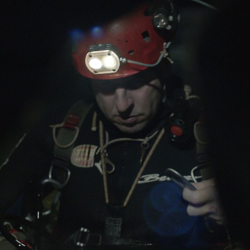 Cave diver Rick Stanton preps for dive. Photograph: National Geographic