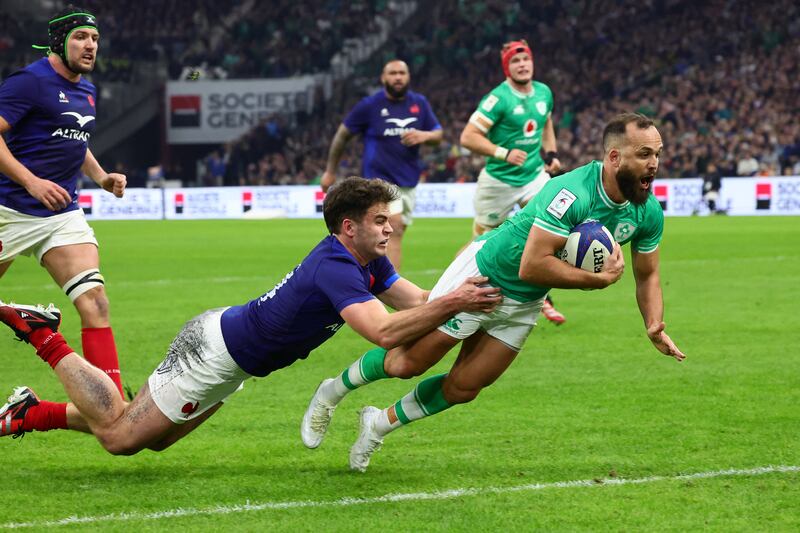 Ireland scrumhalf Jamison Gibson-Park dives for the line to score a try as he is tackled by France's Damian Penaud. Photograph: Clement Mahoudeau/AFP via Getty Images