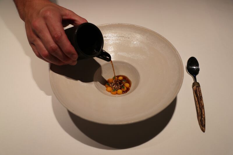 Aimsir: carrots cooked in their own juice with roasted bone marrow, Kalak malted barley, seaweed and smoked bacon broth
