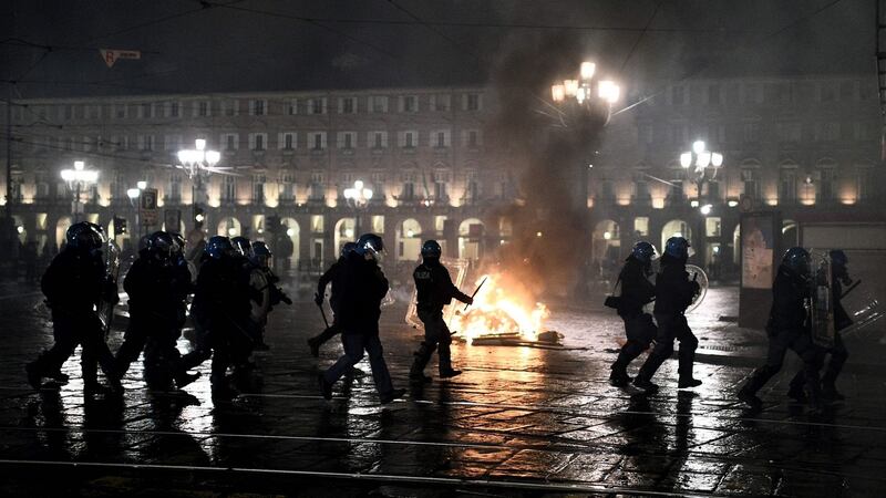 Italian police officers during a protest of far-right activists against government restrictions  in downtown Turin on Monday. Photograph:  Marco Bertorello/AFP via Getty Images