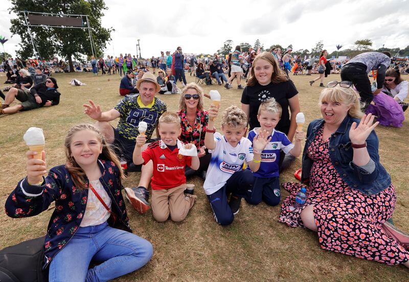 The Horan family from Mountmellick, Co Laois, enjoy ice cream during Wild Youth's set on the final day of the festival. Photograph: Alan Betson
