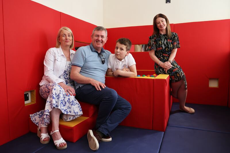 Pupil Jonathan Montgomery (11) with parents (left) Miriam Kenny and Brian Montgomery and (right) Vivienne Wynne, principal of Libermann Spiritan School Templeogue. Photograph: Nick Bradshaw 