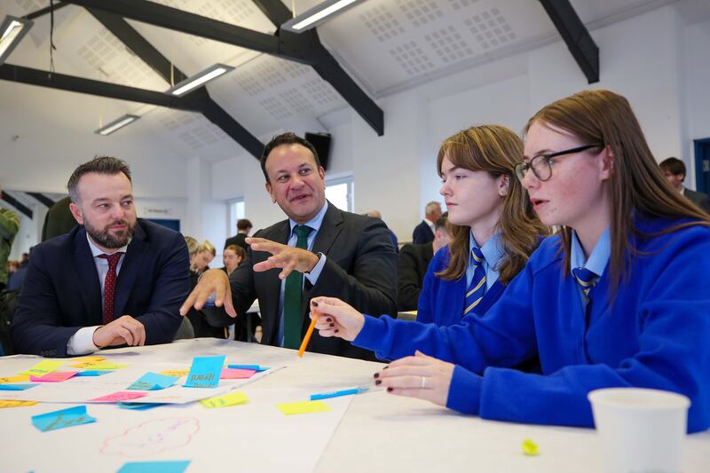 Foyle MP Colum Eastwood and former taoiseach Leo Varadkar meet local school children at the New Ireland Commission event at the Playhouse in Derry on Thursday. Photograph: Kelvin Boyes/Press Eye