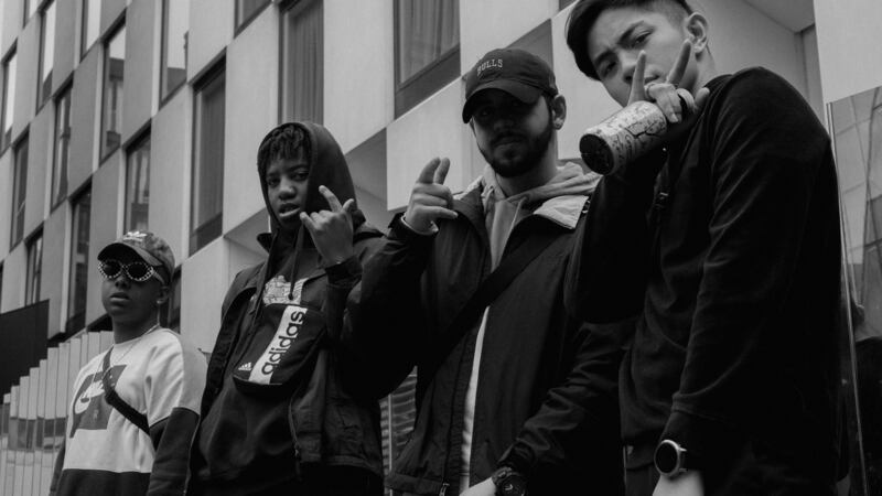 Nuxsenes: These are immigrant tales as old as human history. In this case, they’re set to a booming beat