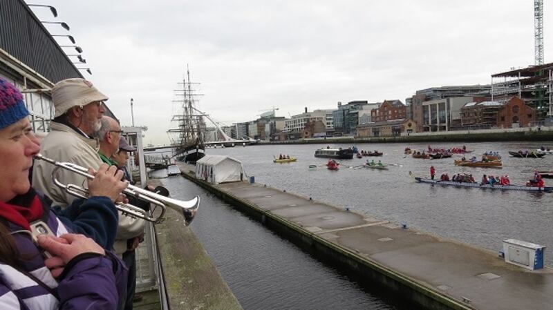 Pat O’Connor plays the Last Post before the All-in-a-Row Flotilla on the Liffey on Saturday.Photograph: Liam Gorman