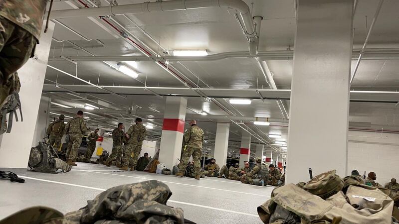 A photo provided to The New York Times shows National Guard soldiers resting in the parking garage of the Thurgood Marshall Federal Judiciary Building in Washington on Thursday. Photograph: New York Times