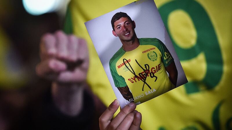 FC Nantes fans hold up pictures of Sala. Photo: Loic Venance/Getty Images