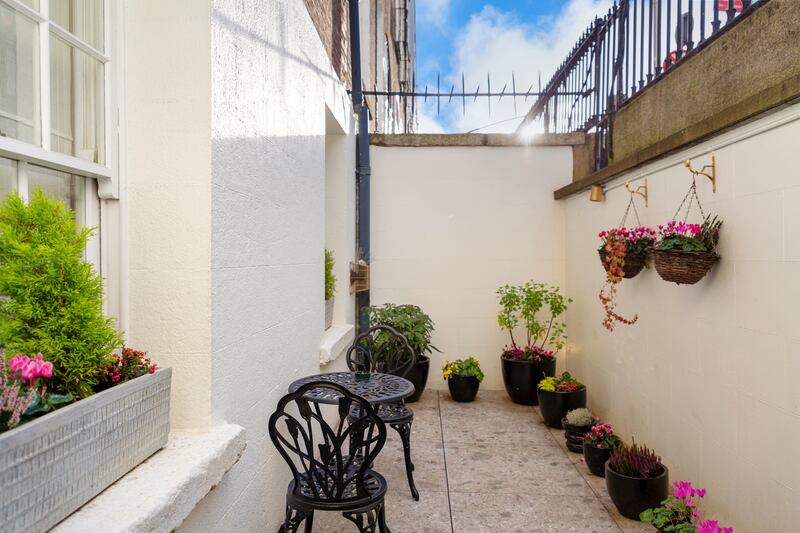 A small terrace lies off the main bedroom downstairs