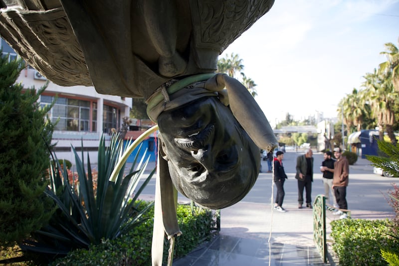 A toppled statue of Hafez al-Assad, father of Bashar al-Assad, at Damascus University in Damascus, Syria. Photograph: Ali Haj Suleiman/Getty Images