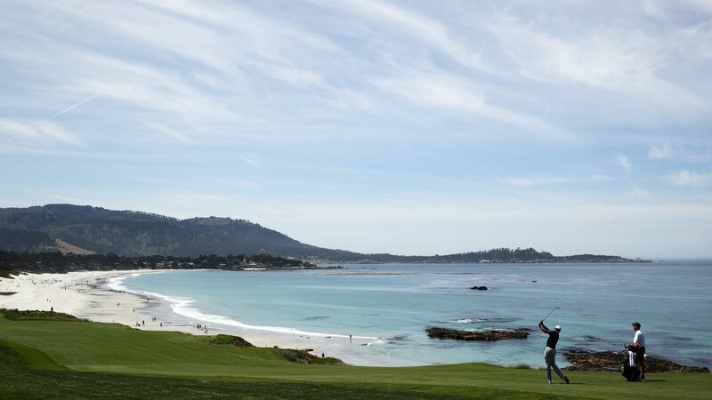 Tiger Woods hits a shot during a practive round. Photo: Ezra Shaw/Getty Images