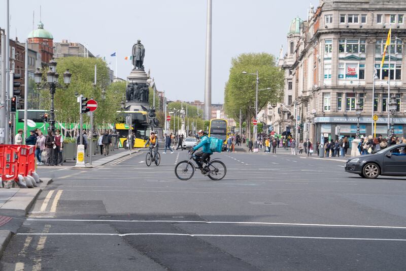 A cyclist makes his way past O’Connell Bridge