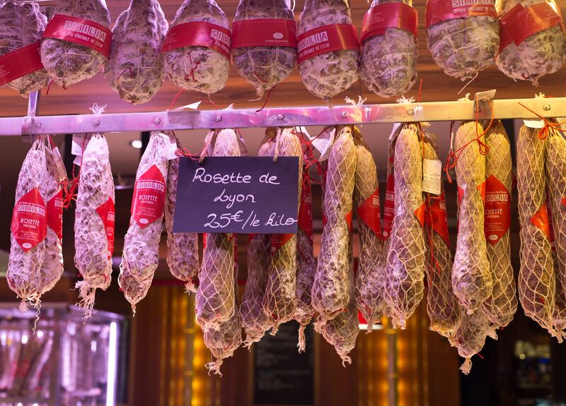 Sausages hang in Les Halles de Lyon Paul Bocuse, a gourmet marketplace named after the famous chef from Lyon. Photograph: Jann Huizenga/Getty