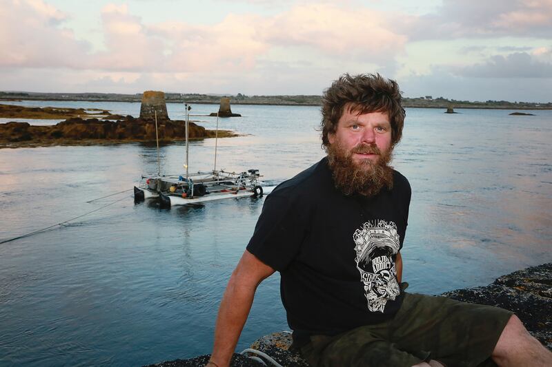 Paddy Bloomer in front of the tidal-powered catamaran he made out of recycled materials. Photograph: Sean Lydon/Lydon Images
