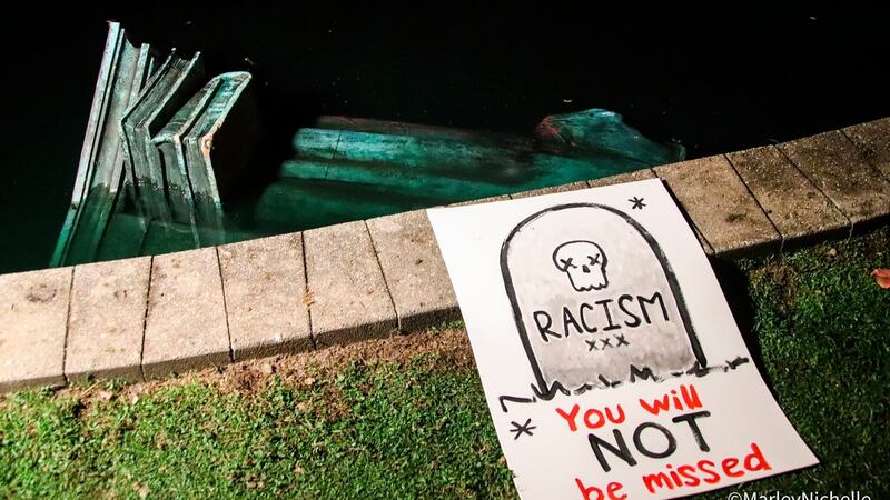 A statue of Christopher Columbus is seen in the water at Byrd Park in Richmond, Virginia, US. Photograph: @marleynichelle via AP