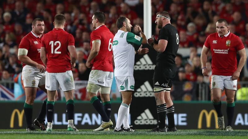 Romain Poite the referee, talks to All Black captain, Kieran Read after he reverses the penalty decision. Photo: David Rogers/Getty Images