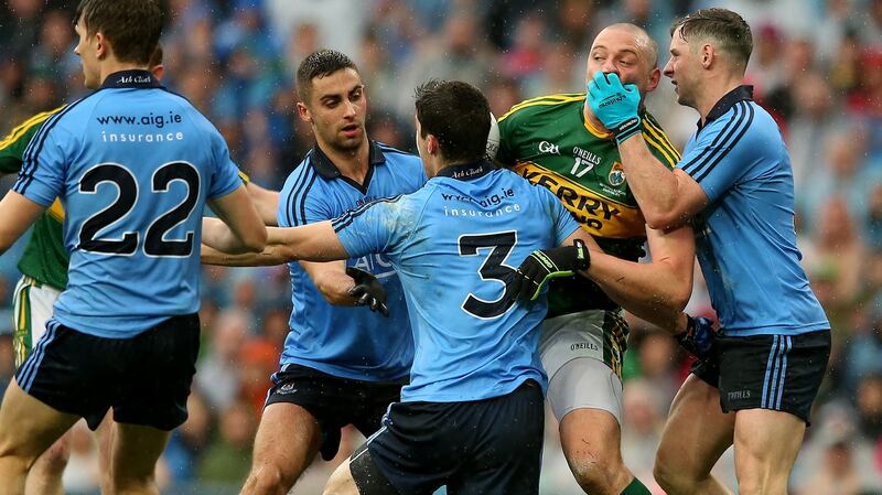 James McCarthy, Rory O’Carroll and Philly McMahon tackle Kieran Donaghy during the 2015 final. Photo: James Crombie/Inpho