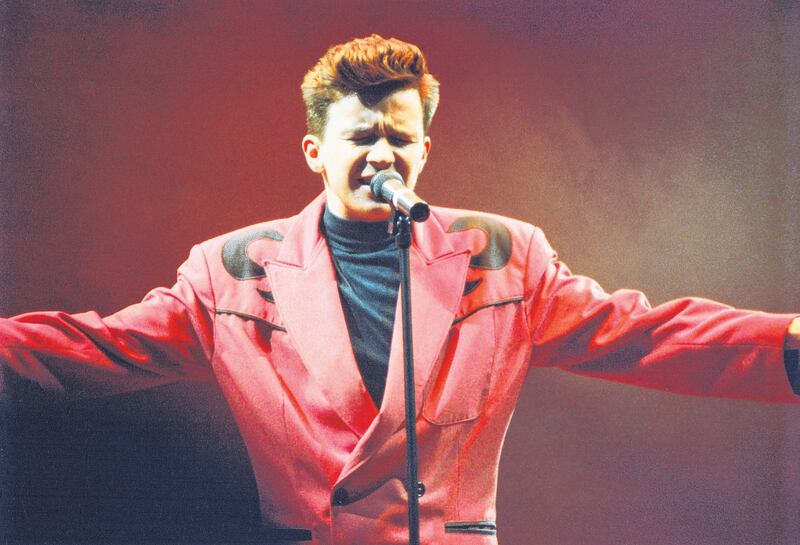 Rick Astley on stage at Wembley Arena in England, 1988. Photograph: Pete Still/Redferns