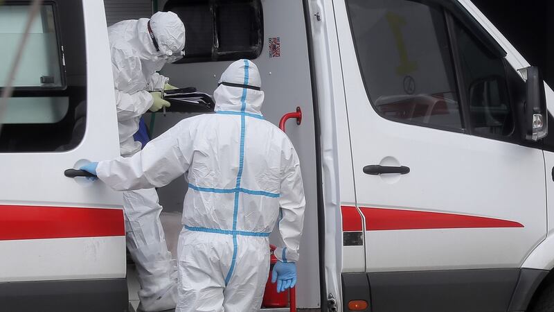 Medical specialists in protective suits wait for patients at the hospital complex for patients  in  Moscow. Photograph: Maxim Shipenkov/EPA