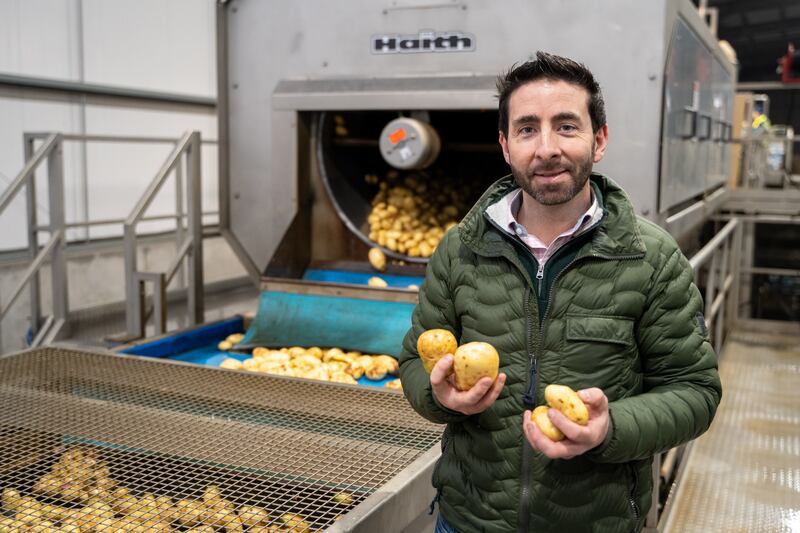 Ross Keogh shown sorting potatoes on the farm