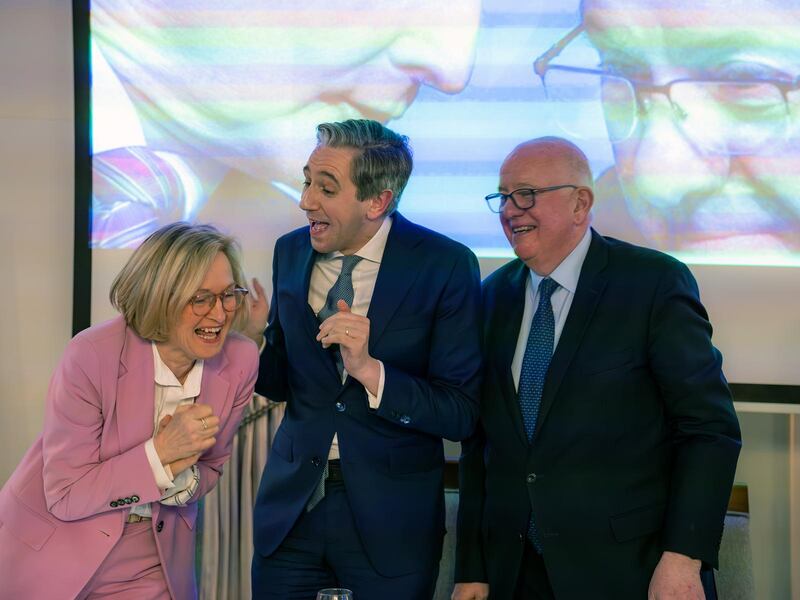 Tánaiste Simon Harris with Mairead McGuinness at a retirement dinner for former minister Charlie Flanagan (right)