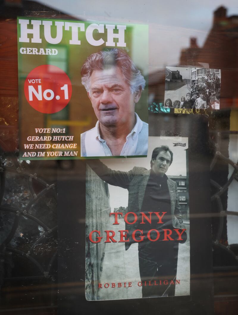 An election poster for Gerry Hutch beside a photo of Tony Gregory in the window of the Bridge Tavern pub in Summerhill, Dublin. Photograph: Bryan O’Brien