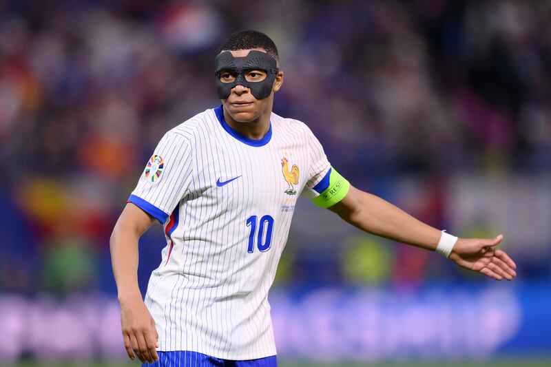 Kylian Mbappé wearing a protective mask during France's Euro 2024 quarter-final against Portugal. Photograph: Justin Setterfield/Getty Images