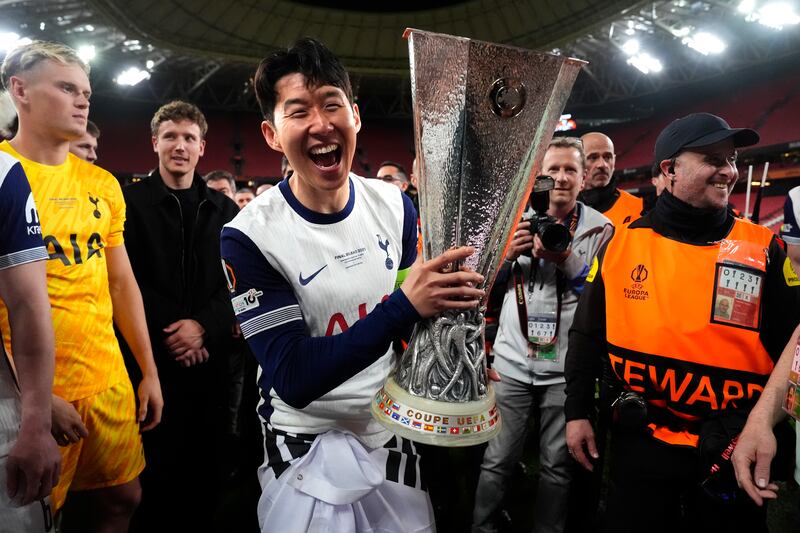 Tottenham Hotspur's Son Heung-Min celebrates with the trophy after the game. Photograpg: Nick Potts/PA