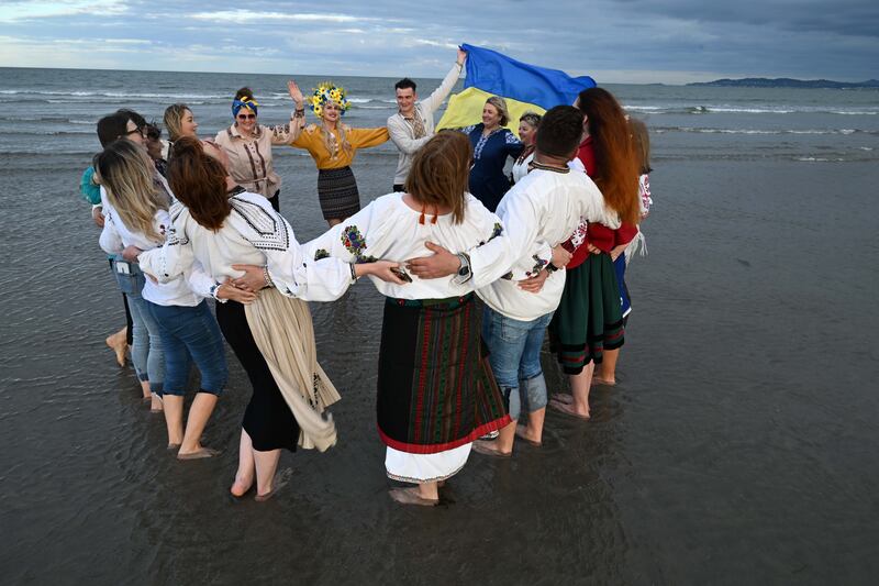 Members of the Ukrainian community in Dublin stage a rally on Dollymount Strand. Photograph: Bryan Meade / The Irish Times
