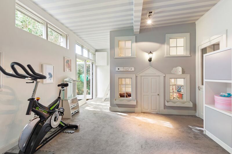 Life size doll's house in the garden studio