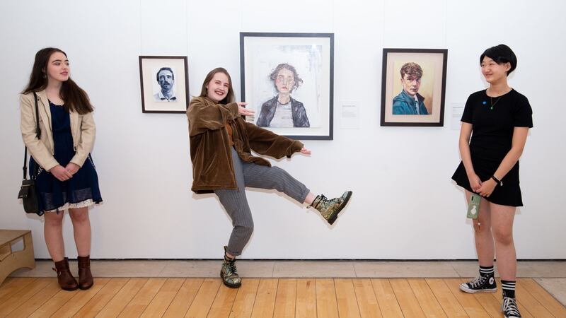 Pictured at Zurich Young Portrait Prize event are (left to right)  Molly Carroll (17) with her painting  Sean, Siobhra O’ Reardon Farrell (17)  with her painting called Elodie, and Rachel Yuxuan Chen (15) with her painting Juvenile. Photograph: Tom Honan /The Irish Times