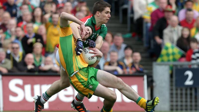 Mark McHugh of Donegal is tackled by Mayo’s Lee Keegan during last year’s All-Ireland football final. Photograph: Morgan Treacy/Inpho