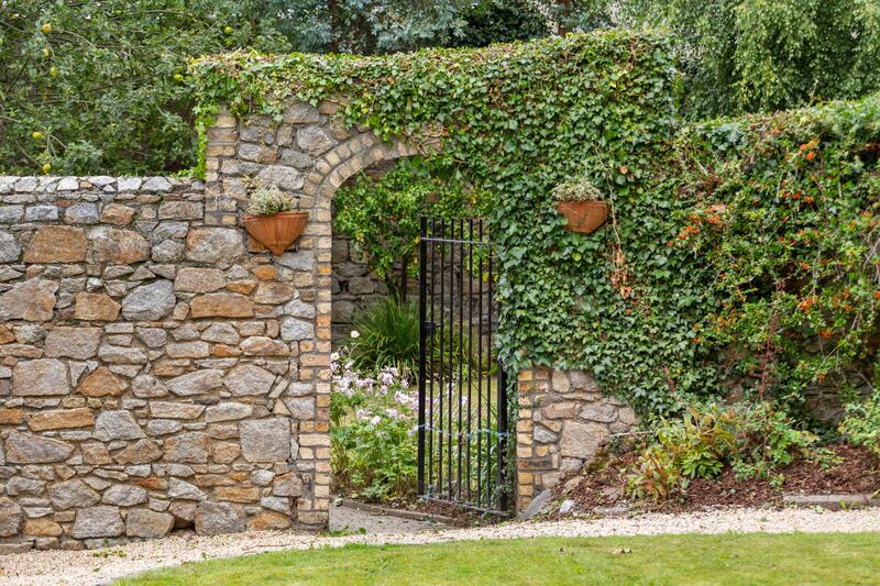 Iron gate in old wall