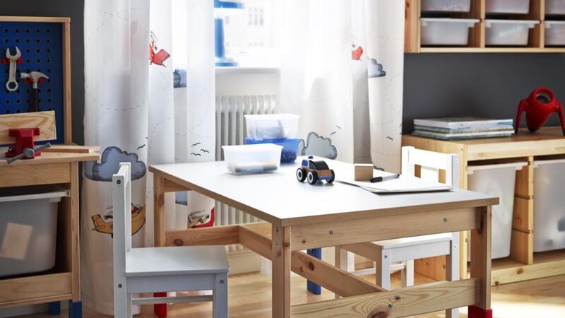 Children’s Sansad pine table with blue and red details, €46, Kritter chairs, €14 each, Trofast frame, €42 (above) and €65 (below) with boxes at €5 and €2.50 each, all Ikea. ikea.ie