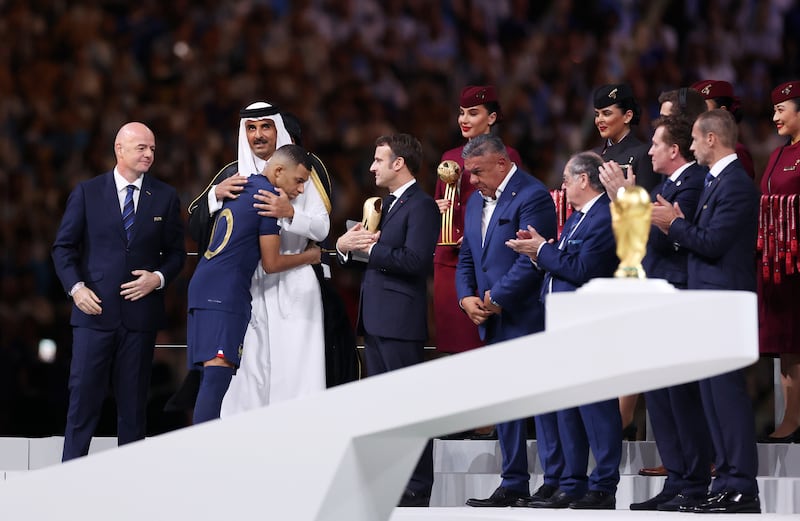 Sheikh Tamim bin Hamad Al Thani, emir of Qatar, congratulates Kylian Mbappe of France after France's World Cup victory. Photograph: Catherine Ivill/Getty Images