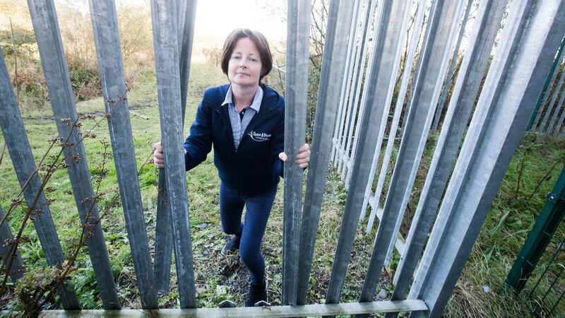 Ciara Brolly at the rear fence where robbers used an angle grinder to cut through it. Photograph Liam Burke/Press 22
