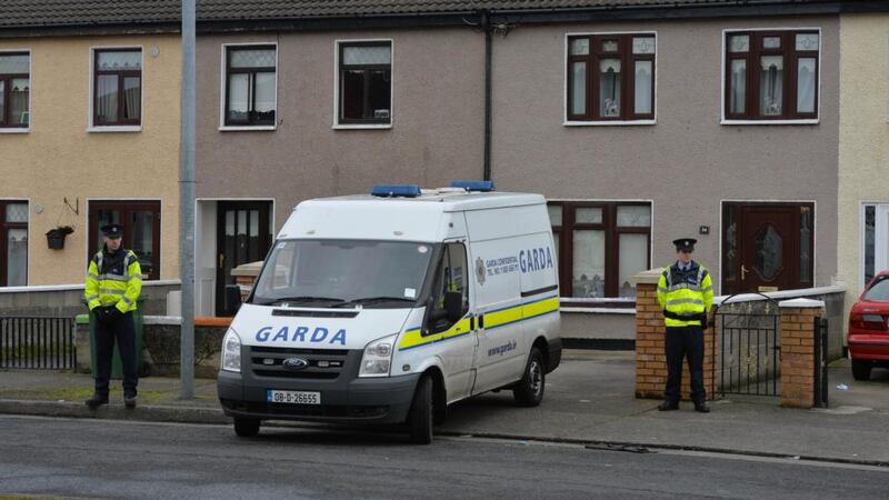 Gardai outside the house on Greensfort Crescent in Clondalkin where John Gilligan was shot while attending a family gathering last night. Photograph: Alan Betson/The Irish Times