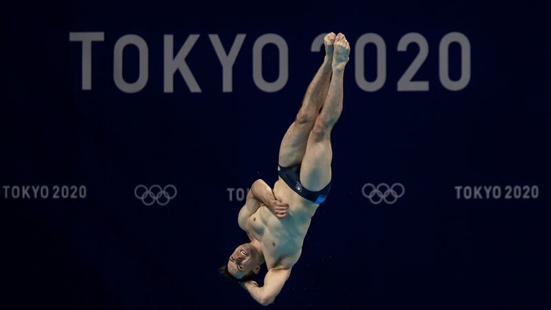 Oliver Dingley competing in the men’s 3m springboard heats. Photo: Morgan Treacy/Inpho