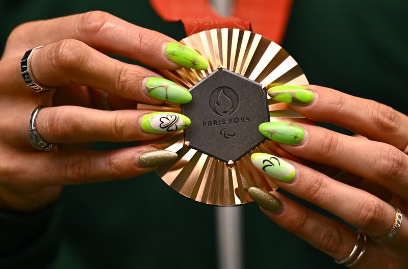 Orla Comerford with her bronze medal from the T13 100m final. Photograph: Harry Murphy/Sportsfile