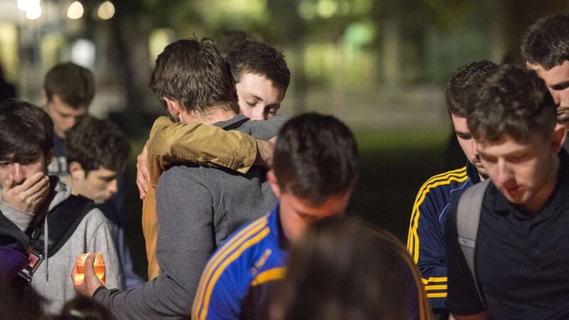 People embrace at a memorial for those who lost their lives after a balcony gave way in Berkeley, California on June 17th. Photograph: Josh Edelson/Getty Images